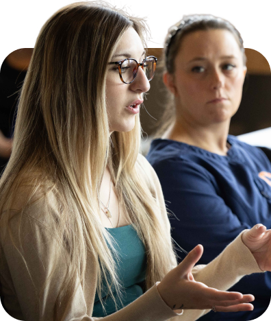 Students in class engaged in discussion.